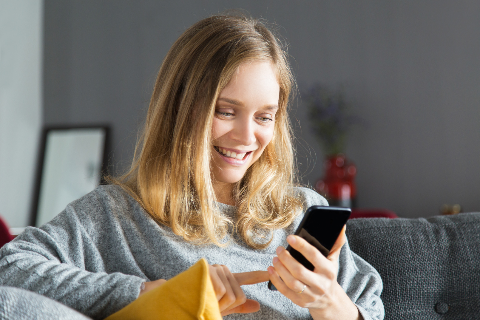 Cheerful phone user excited with new mobile app